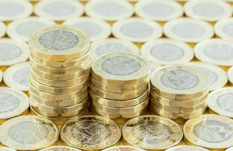 Some new one pound coins. interest rates