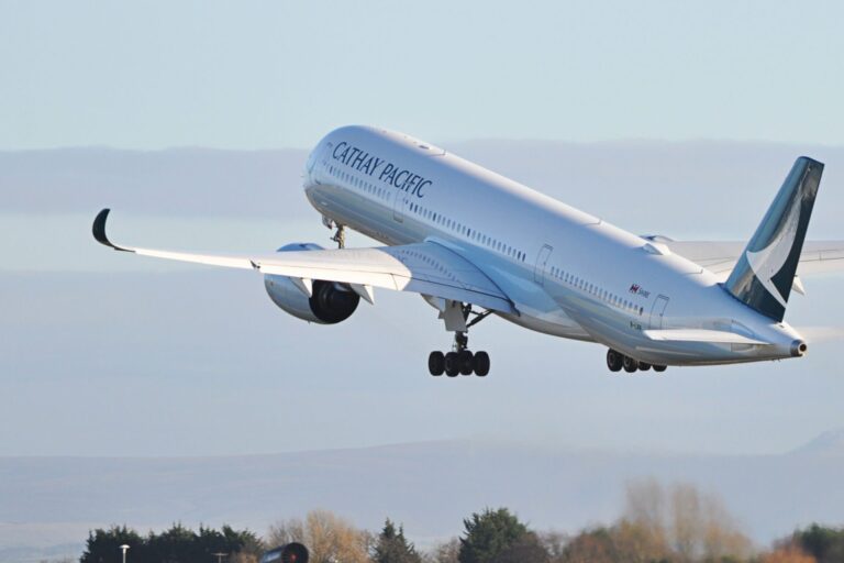 A Cathay Pacific plane takes off from Manchester Airport
