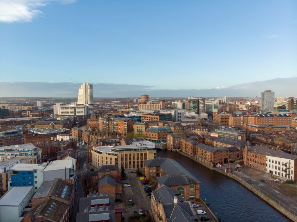 An aerial view of Leeds city centre, showing several impressive property developments