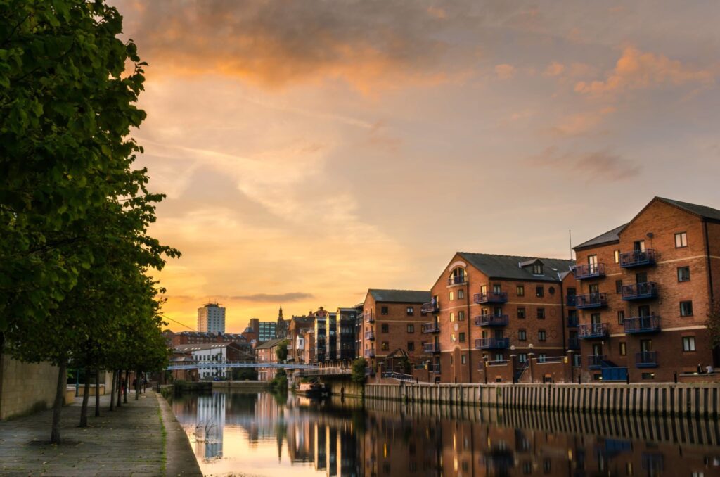A view of Leeds apartment blocks at sunset