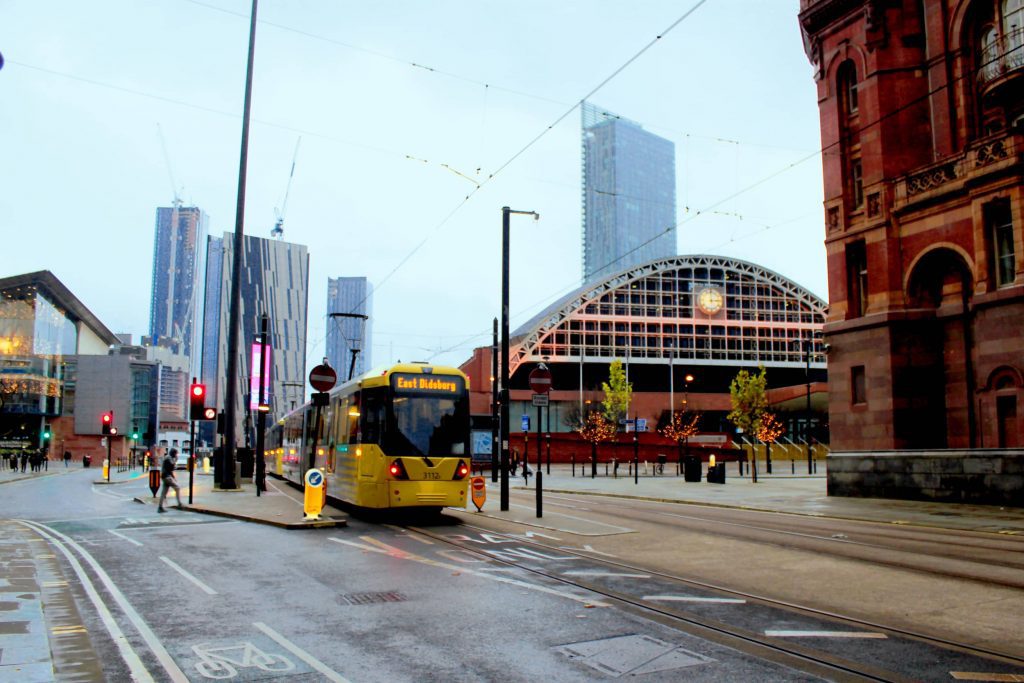 View of high-rise apartment buildings and a tram-line in Manchester