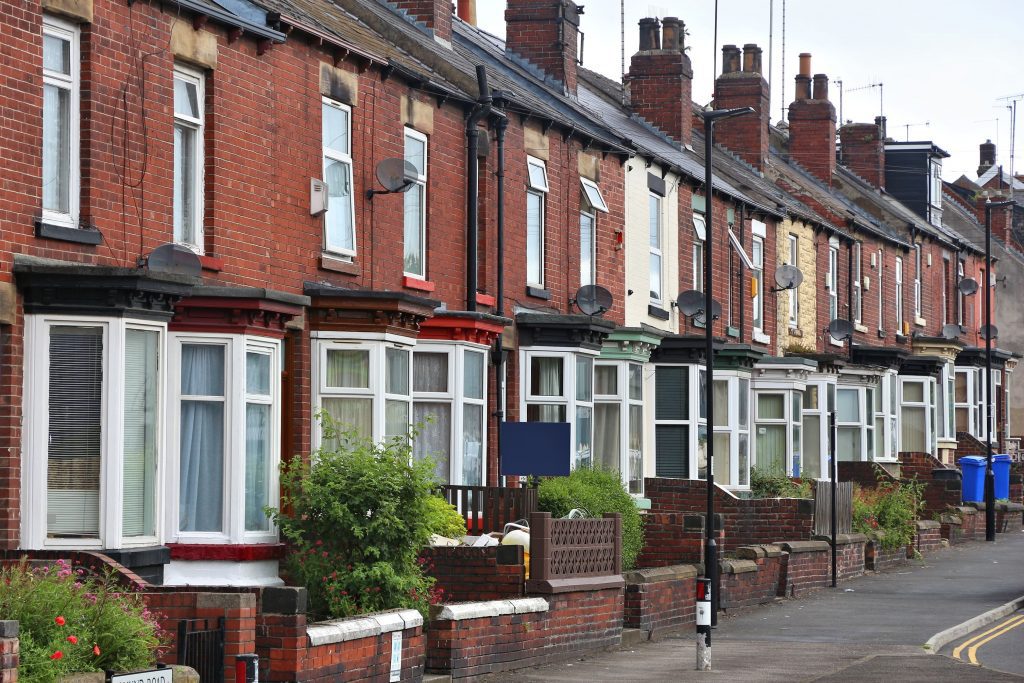 A row of red-brick townhouses in the UK